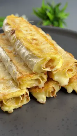 #VNVideoEditor                                           Make an AMAZING Cheese Pita Appetizer.                                                          INGREDIENTS: ●Lavash - 2 large pieces ●Cottage cheese – 250 g ●Cheese - 200 g ●Eggs - 5 pcs ●Salt - to taste ●Black pepper - to taste. ●Vegetable oil - 2 tbsp. 1. Grate the cheese. Add cottage cheese, eggs.  2. Add chopped herbs if desired.  3. Add ground black pepper. Add salt to taste.  4. Cut the pita bread into rectangles.  5. Spread the filling on the pita bread, roll into tubes. Dip in the egg mixture.  6. Fry in a frying pan.  3 minutes on each side over medium heat, covered. 7. Or you can brush with yolk and bake in the oven at 180 degrees for 15 minutes until golden brown. ●It's incredibly delicious and very simple!!!● Bon appetit! The recipe in your language is available in the description, 💖🇺🇦🇵🇱🇩🇪🇺🇸🇫🇰🇪🇸🇵🇹🇮🇹🇷🇴 🇷🇸🇭🇷🇱🇻🇸🇮🇨🇿🇫🇮🇸🇪🇩🇰🇳🇴 🇯🇵 🇬🇷 🇮🇱🇰🇿🇰🇬🇱🇻🇹🇼 🇵🇪 🇦🇷 🇨🇱 🇻🇪 🇹🇭 🇧🇷                       #pitabread #lavash #appetizer #simplydeliciousrecipes 