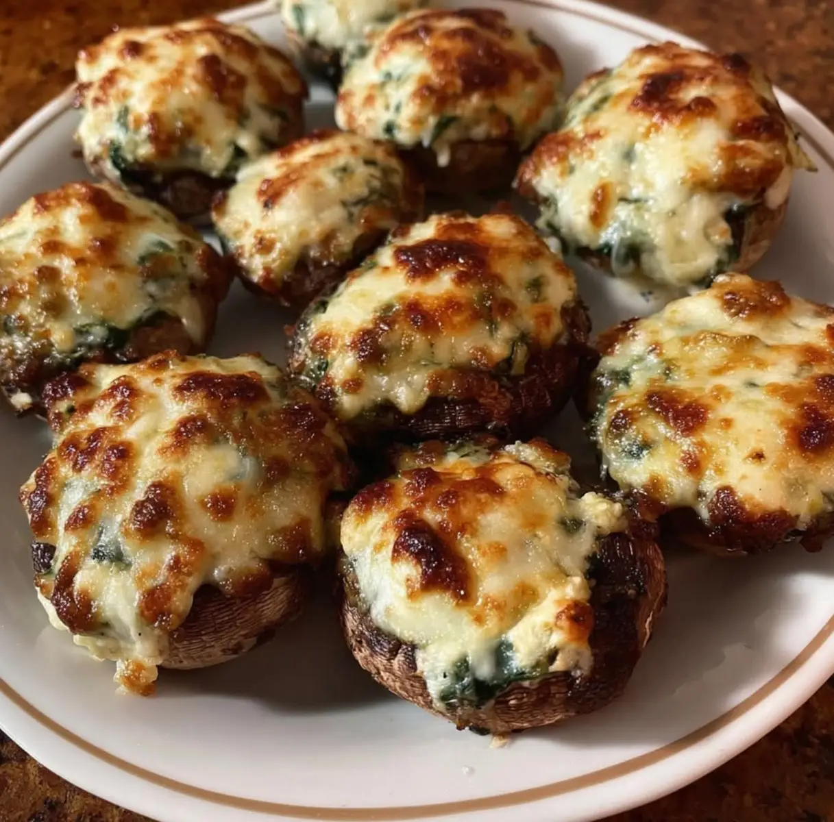 Air fryer Stuffed mushrooms anyone??  My kids love these! And they are so easy to make!!  Ingredients* 12 Medium Size Mushrooms 1 Block Cream Cheese  1 Tbs. minced garlic  1/2 Tsp. Garlic powder (Optional—I put A1 sauce about 1/2 tbs.)  Bag of spinach  1 bag Mozzarella Shredded Cheese  Salt & Pepper  *Wash and take the stems out of mushrooms use a spoon and take a little bit out of the center when removing the stems *Cut spinach, add cream cheese and all spices. And mix until your arm hurts ☺️  *Stuff mushrooms with mixture and dip them in the shredded mozzarella.  I used my air fryer! Spray bottom with oil and place mushrooms in air fryer at 400° for 10-15 min. Or until cheese is golden brown!  They are delicious!! Hope you enjoy 😉
