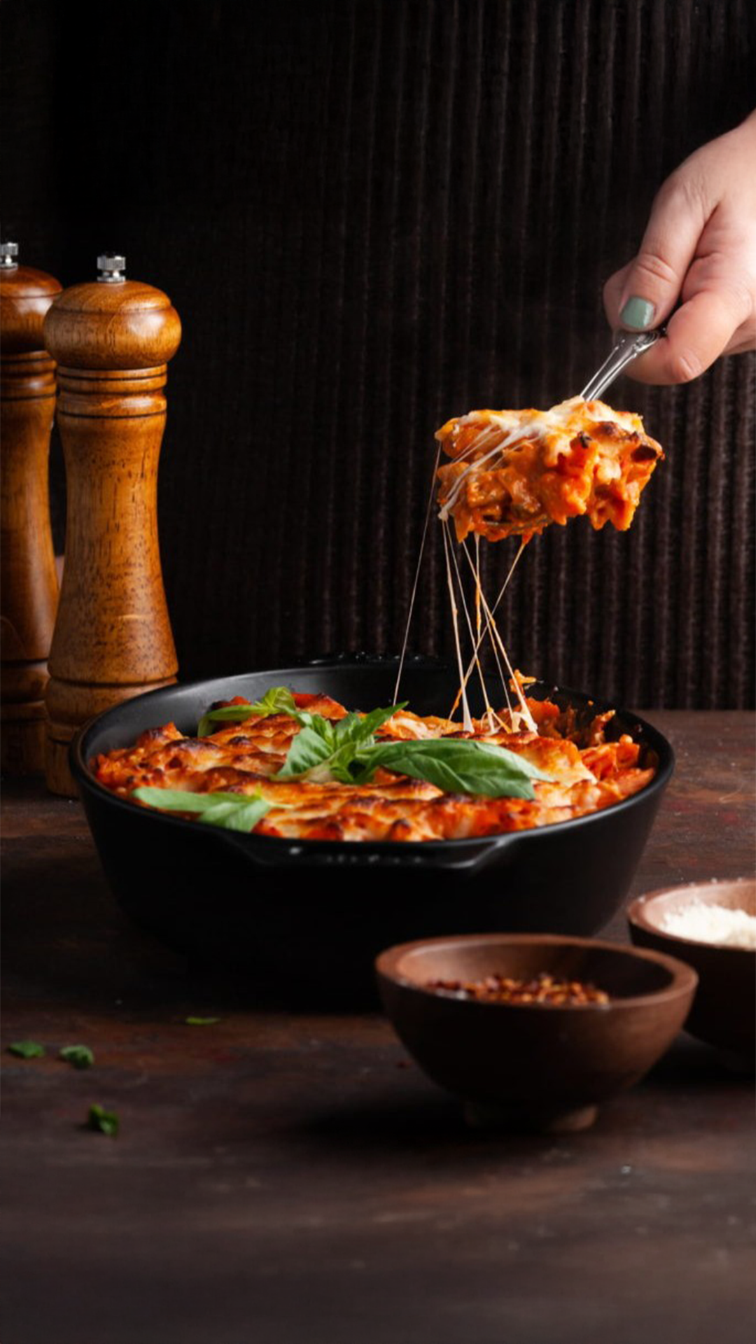 This Easy Cheesy Pasta Bake is a family favorite for the ultimate comfort food dish. It's filling, delicious, and oh... did I mention cheesy?   Easy Cheesy Pasta Bake with Marinara 1 large yellow onion, diced -8 ounces mushrooms, chopped -2 tablespoons olive oil -¼ teaspoon salt -¼ teaspoon black pepper -¼ teaspoon crushed red pepper (optional) -16 ounces Penne Rigate -24.5 ounces (~3 cups) marinara sauce -4 cloves garlic, minced -4 ounces cream cheese -8 ounces Italian shredded cheese blend -4 ounces shredded mozzarella -1 handful Fresh basil for garnish   -Preheat your oven to 375°F and boil about 10 cups of water for your pasta. -Add the mushrooms and onions to a large pan over medium heat with olive oil, salt, pepper, and crushed red pepper (optional). Cook until the mushrooms shrink and the onions turn translucent—about 5 minutes. -Once water is boiling, cook pasta until al dente, according to the directions on the box (usually about 6-10 minutes). Strain and set aside to dry completely. -Add the marinara sauce to the mushrooms and onions to cook off any excess liquid in the sauce. Turn the heat source down to low. and stir frequently to avoid splatter. -Once your sauce thickens, add the cream cheese, shredded Italian blend cheese, and minced garlic and stir over low heat to combine. -Add the cooked pasta to the sauce and remove it from heat. Stir until the pasta is coated. -Transfer the pasta to a 9 x 13-inch glass baking dish. Top with an even, thin layer of mozzarella. -Bake for 25 minutes or until the cheesy top is golden brown. Garnish with fresh basil and enjoy with family and friends or keep for up to 5 days in the refrigerator. #EasyPastaBake #CheesyPastaRecipe #HomemadePastaBake
