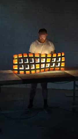 square waffles . . final assembly of the warp light - installing each light cell and watch the illumination transition from harsh LED to a soft warm glow #modernlighting #lightsculpture 