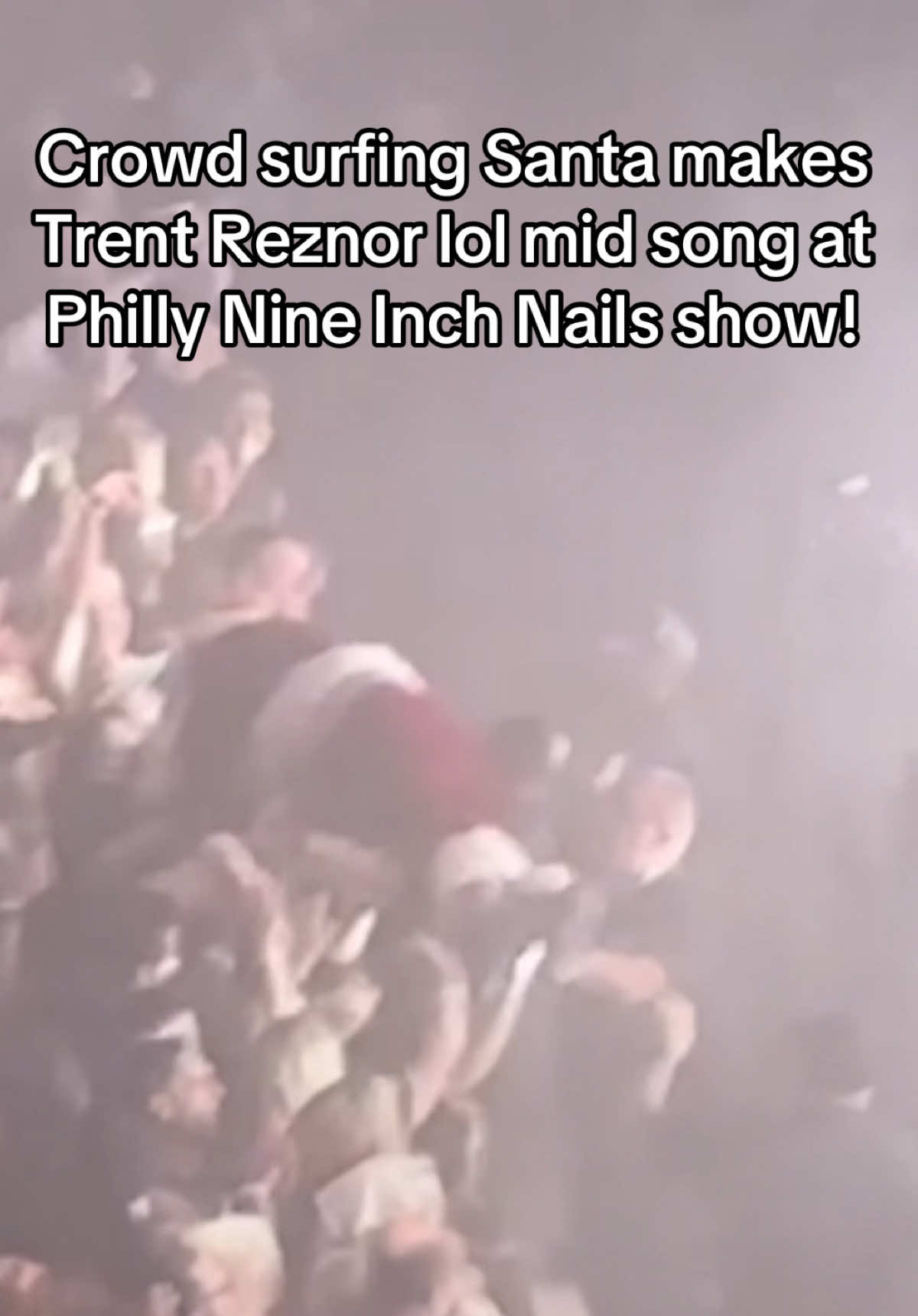 A crowd surfing Santa Claus made Trent Reznor bust out laughing in the middle of ‘Head Like a Hole’ during the August 26, 2025 Nine Inch Nails concert in Philadelphia. This was legitimately my 50th time seeing NIN (my son’s first!) and I can’t ever recall seeing TR need a moment to get out a few laughs. Incredible show, as always, by @Nine Inch Nails  - the greatest live band I’ve ever seen. If you have a chance to see this band live, run to the show! #nin #nineinchnails #@👑_02🔥🔥 trentreznor #fyp #santaclaus 