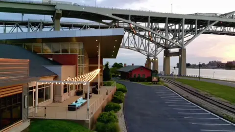 The first light of day rising at the Blue Water Bridges in Port Huron 😍 at the Blue Water Convention Center & the DoubleTree by Hilton Hotel.  #peaceful #michigan #sunrise 