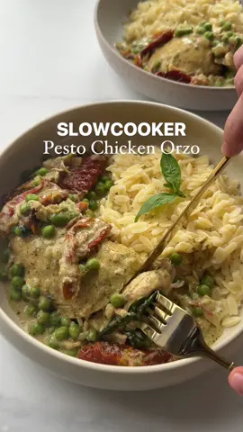 Slowcooker Creamy Pesto Chicken 🍗   Comfort food but you only have 5 minutes to prep? I got you! You can serve this with some pasta, I used orzo or even a nice salad/rice.    Serves 3 or 4 if you had an extra chicken breast 530 calories per person   Ingredients: 3-4 chicken breasts 1 white onion, diced 1 tbsp garlic puree 100ml chicken stock 4 tbsp green pesto 150g sun-dried tomatoes 80 g frozen peas 2 tbsp creme fraiche, reduced fat 300g orzo, cooked Parmesan, to serve   Method: 1. Add your chicken, diced onion, garlic puree, chicken stock, pesto and sundried tomatoes to the slowcooker and cook on high for 3-4 hours or low for 7-8. 2. Once ready, add your frozen peas and some creme fraiche. Give that a good stir then prepare your orzo. If the sauce is runny add cornflour  3. Cook your orzo as per packet instructions then serve immediately.   Enjoy 😊   #boredoflunch #Recipe #recipes #pesto #pestochicken     