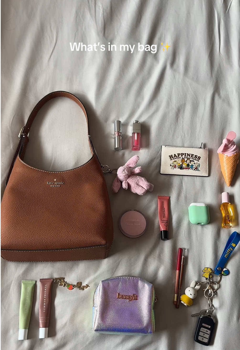 What’s in my bag ✨ you can never have too many lip products 💋 what  bag are you   currently wearing?  #whatsinmybag #katespade #fyp #coach  @kate spade new york @Jellycat @Coach @Gisou @e.l.f. Cosmetics @Summer Fridays @Benefit Cosmetics @loréal paris usa @COVERGIRL @YSL Beauty @Diorbeauty @Miffy 