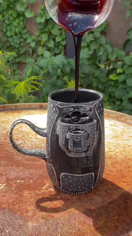 Havent made one of these in a while, love the way the sun catches the black porcelain 🌞😸 . . . . #pottery #ceramics #cup #mug #potterytiktok #funny #prank #barf #hehe #humor #gross #art #artist #artistsoftiktok #barfmug #cat #catsoftiktok #cats #cars 