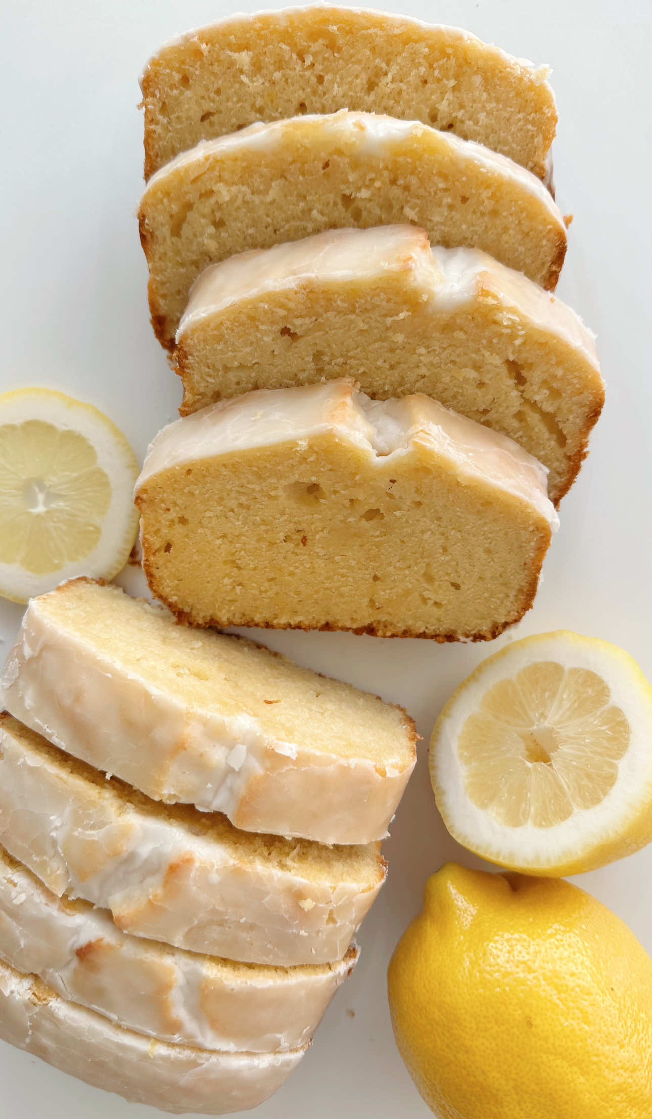 Lemon Loaf Made Easy 🍋Lemon Series Ep. 6 This is the easiest thing to bake and it will for sure WOW your fam + friends! The lemon flavor is bright and it’s deliciously moist. The lemon glaze adds a nice layer of subtle sweetness. A must bake IMO! 🤗 Start by preheating your oven to 350 degrees and lining a loaf pan with parchment paper that has about an inch hanging out of the pan.  In a large bowl massage together 1 cup sugar and the zest of one whole lemon. Next add 1/4 cup melted butter and 1/4 cup vegetable oil and mix. Then add 2 tsp vanilla and 1 tsp lemon extract, 3 eggs, 1/3 cup milk and 1/3 cup Greek yogurt. Whisk until everything is well combined. Ditch the whisk and switch to a spatula to fold in 1 3/4 cups flour, 1 tsp baking powder and 1/2 tsp salt. Pour the natter into the loaf pan and bake for 55-60 minutes or until a toothpick inserted in the center comes out clean.  To make the glaze whisk together 2 cups of sifted powder sugar, milk and the juice of half a lemon. Once the loaf has full cooled, pour on the glaze. Let the glaze set for 15 minutes before slicing!  #EasyRecipe #lemonloaf 