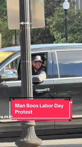 Man in a black Dodge Ram yelled at and booed protesters as he drove past a Labor Day protest in DuPont Circle on 8/28/25 