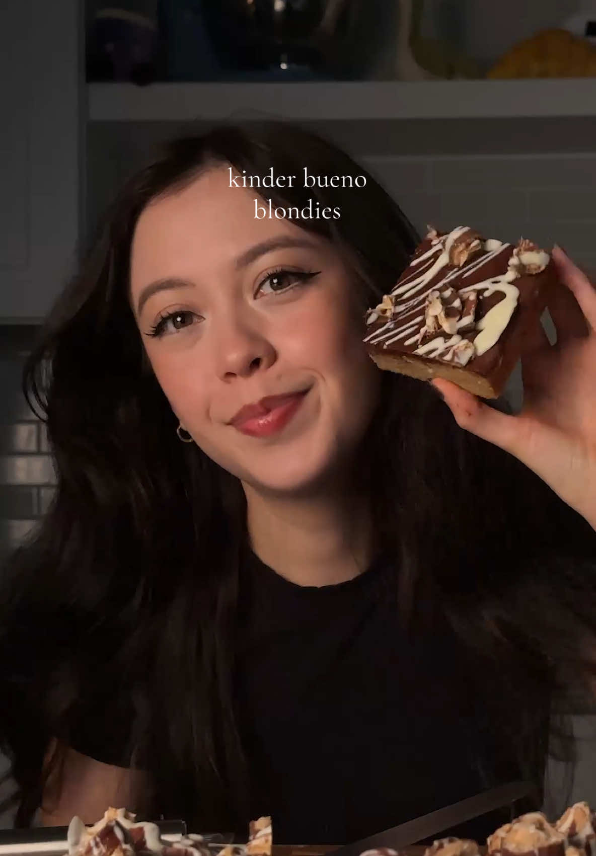 kinder bueno blondies blondies: 3/4 cup (170g) unsalted butter, softened 2 cups (250g) flour 1 1/4 tsp (5g) baking powder 1/2 tsp (3g) salt 1 1/2 cups (300g)  light brown sugar 1 tsp (4g) vanilla 2 eggs 4 kinder bueno sticks *cream together butter and sugar until smooth and then add vanilla and eggs. set aside. in another bowl, combine flour, baking powder, and salt. combine the dry and wet until barely combine (you still want to see flour streaks) and then add in your chopped bueno bars. pour into 9x9 pan and bake at 325 for 38-42 min.  ganache + topping: 1/3 cup heavy cream 3/4 cup (130g)  milk chocolate, small chopped 3 kinder bueno bars melted white chocolate *microwave the heavy cream in about 20 second bursts until nice and warm. then add in the small chopped chocolate until all smooth. pour over the cooled baked blondies and top with broken up bueno bars. optional: drizzle on melted white chocolate! #kinderbueno #blondies #baking #Recipe #emijuju 