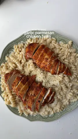 Creamy Garlic Parmesan Chicken Pasta Ingredients  For the chicken: 1 lb chicken breast. Salt to taste 1 tsp smoked paprika powder  1 tsp black pepper  1 tbsp garlic powder  1 tbsp oil (for marinade)  3 tbsp oil for cooking  For the sauce:  2 tbsp butter  1 yellow onion finely chopped  6 garlic cloves , finely minced  2 tbsp all purpose flour  1 1/2 cup chicken broth  1 cup heavy whipping cream  Salt to taste 1 tbsp garlic powder  1 tsp black pepper  1 tbsp fresh parsley, chopped  1/2 cup Parmesan cheese  To assemble: 300g uncooked pasta of choice  1/2 cup pasta water Parmesan cheese for garnish  Method: Cook pasta in salt water according to package instructions and set aside . Reserve half cup pasta for later use. Marinate the chicken: season the chicken with salt pepper, garlic powder, smoked paprika powder and oil. Mix well and let it marinate for at least an hour in refrigerator. In a pan add some oil. Add the marinated chicken to the pan on medium heat. Cover and Cook the chicken on both side for 15-20 min or until it reaches internal temperature of 165 F.  Remove the chicken from the pan once cooked add butter. Once the butter is melted add garlic and onion. Sauté for 2-3 min or until fragrant. Add all purpose flour and mix . Pour in chicken broth and cook for 2-3 mim stirring constantly until the sauce thickens. Add garlic powder and black pepper. Mix to combine. Add in heavy whipping cream. Mix and cook the sauce on medium low until the sauce thickens. Add Parmesan cheese and mix. Taste and adjust salt to your preference. Add parsley , mix to combine.  If the sauce is too thick you can add pasta water to loosen the sauce.  Add boiled pasta and mix to combine. Slice the chicken and add it to the pasta. Garnish with more Parmesan cheese if desired Serve warm and enjoy. #pasta #Recipe 
