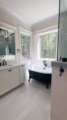 Check out this primary bathroom and closet!  #primarybathroom #bathroom #clawfoottub #tile 