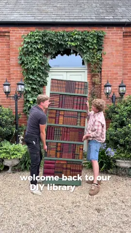 DIY Library Part 3! We’ve FINALLY created the secret door and added statement panelling! I went for these gorgeous pre-primed reeded panels from @naturewall – crafted in Yorkshire by the good people of the North. They’re super easy to cut to size and the fact they come pre-primed made painting them an absolute breeze. We built bookcases around a doorway, added shelf fronts and faux books to disguise the door, and painted it all in Beverley by F&B for that timeless library feel. I can’t believe we DIY’d this entire space — it’s been such a labour of love to create, but so worth it. It’s becoming our library of dreams. Still hunting for books & curiosities to give it that Jurassic Park natural history vibe! Would you have gone navy or green for the finish? #panellinghack #naturewall #diylibrary #library #renovation  