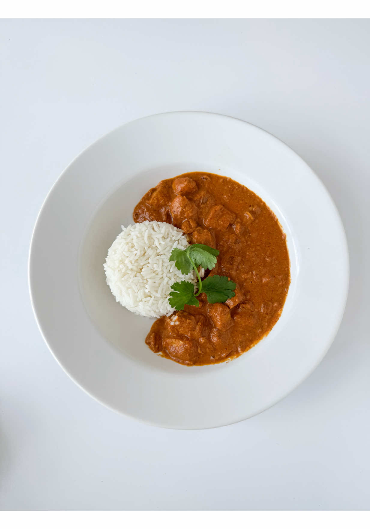 Butter chicken ⬇️ And yes, you can eat food like this and hit your goals. Argue with ya mama.  Chicken Marinade  16 oz. chicken breasts (diced)  3/4 cup whole yogurt (plain)  1 tbsp ginger (grated, fresh)  5 garlic cloves (grated, fresh) 1/2 lemon (squeezed)  1 tbsp garam masala  1 tbsp cumin  1 tsp chili powder 1 tsp cayenne  1 tsp turmeric  1 tsp paprika  Curry  2 tbsp butter  1 yellow onion (small, diced)  1 cup crushed tomatoes (or just blend up some diced tomatoes) 3/4 cup cream (I use heavy, you can def use half/half if needed)  1/2 tbsp ginger (fresh, grated) 3 garlic cloves (fresh, grated)  1 tbsp garam masala  1/5 tbsp cumin  2 tsp ground corinader  1 tsp sugar  1/4 cup water (optional, but I think it helps out the consistency)  **If your curry is thick, use an immersion blender to thin it out before adding your chicken  For sides  .5 cups of basmati rice (in each portion)  Naan  (~589 per portion, about 1 cup curry/chicken, .5 cups cooked rice, and naan) ___ Full recipe and instructions inside Shetrition!  If you’re ready to level up your weight loss and lose weight for good, I’d absolutely love to have you in my weight loss program! ✨ 🔗 Links in bio to start your free trial!