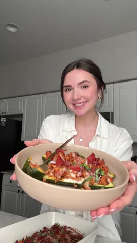 PIZZA STUFFED ZUCCHINI BOATS 🍕 Ingredients: ZUCCHINI 4 medium zucchini (784 g) 1/2 tbsp olive oil (7 g) pinch salt + pepper 1 cup mozzarella cheese (84 g) grated fresh basil optional, to garnish FILLING 1 lb lean ground turkey I use 93/7 2 tsp Italian seasoning 1 tsp salt 1/2 tsp pepper 1 1/2 cups marinara sauce (339 g) 1/2 5oz bag turkey pepperoni (75 g) roughly chopped Instructions: 1. Preheat oven to 400F and lightly grease a 9×13 baking dish. 2. Cut zucchinis in half lengthwise and use a teaspoon to scoop out insides, leaving ~1/4 in thick border. Finely chop scooped zucchini flesh and place in a clean kitchen towel or paper towel, squeezing out as much excess water as possible. Set aside. 3. Arrange zucchini boats in the baking dish, cut sides up. Brush with olive oil and lightly season with salt and pepper. 4. Heat a large frying pan on medium high and lightly spray with oil. Add turkey and fully cook, breaking apart into small pieces. Add extra chopped zucchini halfway through. 5. Add Italian seasoning, salt, pepper, marinara sauce, and pepperoni, stirring to combine. Reduce heat and gently simmer 5-10 minutes, until thickened. 6. Scoop filling evenly into zucchini boats and bake 25 minutes. Top with cheese and bake another 3-5 minutes, until melted. Sprinkle with optional basil and enjoy! IMPORTANT NOTES: •Zucchini holds a lot of water – squeezing out the moisture before adding the insides to the sauce keeps filling thick instead of runny. Additionally, use a folded paper towel to soak up excess liquid cooked off of the turkey (if needed), and make sure to let the filling simmer long enough to reduce. The filling should be very thick. •These will be stuffed very full – for less filling, save zucchini filling for muffins, bread, or scrambles instead. •Every oven is different and some zucchinis are tougher than others. If you’re using larger zucchini or thicker garden zucchini, you may need to bake them longer before adding cheese. •If using pre-made, check for salt and adjust salt levels as needed. https://myproteinpantry.com/pizza-stuffed-zucchini-boats/ #highprotein #EasyRecipes #healthyfood #healthyrecipes #dinner