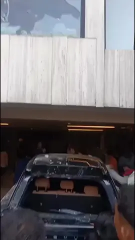 Ahmad Sahroni's House in Tanjung Priok was raided by the crowd, belongings were looted. In the video, it is seen that the crowd destroys a Lexus car parked in the garage, taking and furniture items . . . #demo #jakarta #fyp #dpr #demodpr 