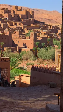 Ait Ben Haddou, Morocco’s most enchanting town The jewel in the crown among the scores of kasbahs to be found in the south of Morocco is located 30 kilometres from Ouarzazate. On the edge of the desert, the adobe-built houses of Ait Ben Haddou’s impressive ksar stand at the foot of a cliff, and evoke in the visitor a sense of having travelled back in time. A ksar is a fortified settlement of Berber origin, with many kasbahs inside it. In north Africa, it is typically built from traditional materials such as adobe or wood. Ait Ben Haddou is Morocco’s most famous ksar, and probably one of the country’s most remarkable and fascinating monuments. Stepping inside this stronghold is momentarily disorientating. The narrow streets and passages of this urban labyrinth twist around mostly uninhabited houses with several centuries of history behind them and which defy the passing of the years. In common with other ksars, Ait Ben Haddou has provided the setting for many top feature films. As we shall see, its architecture provides a perfect set for films and series. History of the Ait Ben Haddou ksar The town is named in honour of its founder, Ben Haddou who, according to legend, established a tribe here in 757. It is believed that his tomb lies beneath the town. Construction of the present ksar dates from the seventeenth century, when the town gained strategic importance in north Africa.     The key to Ait Ben Haddou’s importance is that it was a very important stop on the route of traders travelling between Marrakesh and the Sahara. Caravans transported gold, silver and spices on the trans-Saharan trade routes which for a thousand years linked the lands that are now Morocco, Mali, Ghana, Niger, and Sudan. The citadel provided a place of refuge for these traders. With an inn, a mosque, a granary and other services, it was a place where they could stop off during the months-long journeys  #morocco #maroc #marruecos  #tour #trip