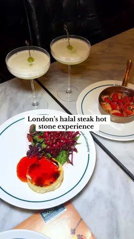 London’s halal hot stone steak experience  You’ve got to add this one to your list but right at the top because this was a phenomenal way to eat steak. It always stays hot, tender and buttery throughout because you cook it as you’re eating and the hot stone stays hot for a loooong time.  I chose the rib eye (fatty, rich, juicy), truffle salt and garlic parsley butter with mushroom sauce. So so so good. We paired this with the creamiest smoothest mash and thickest crispiest chips.  Chilli king orans and goats baked cheese were an explosion of flavours especially when paired with the warm bread and to end we went with the apple crumble.  #steakandcompany #halalsteak #hotstonesteak #london #viralrestaurant 