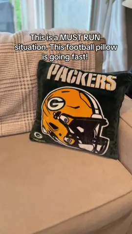This football pillow is going to be so perfect on our couch for our Sunday football game days and hosting with people over while showing and representing our football team, but also being comfy and cozy! #football #nflfootball #gameday #giftsforhim #sundayfootball 