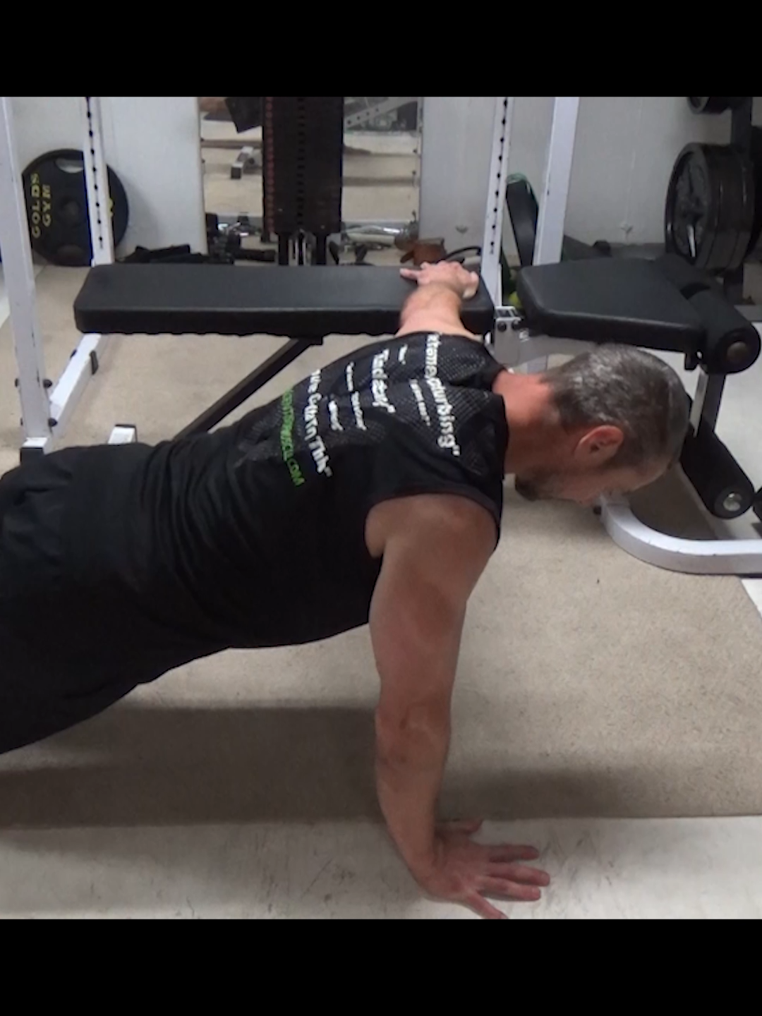 Outrigger One-Arm Bench Push-Ups - this is a great way to increase the loading on the chest with a bodyweight exercise. All you need is an elevated surface like a bench, chair or even stairs to do this one, making it a great home exercise or hotel exercise when you're traveling. For one-arm training, the 