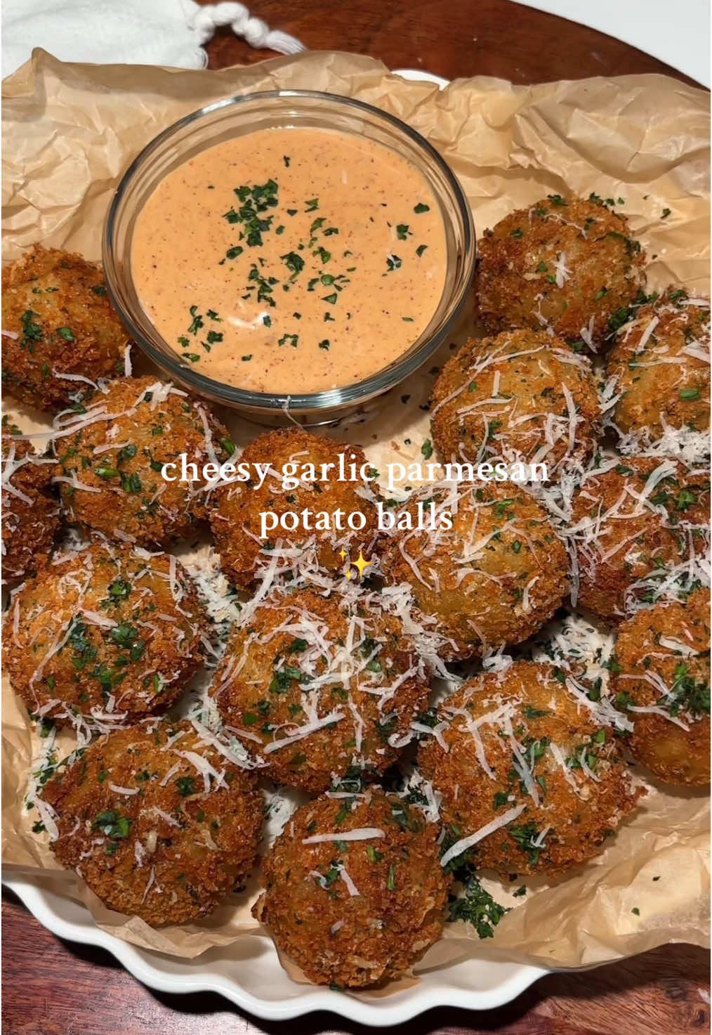 Cheesy crispy garlic Parmesan potato balls ✨ Ingredients  - 5 russet or Yukon potatoes, peeled and sliced - 1/4 cup Parmesan cheese, shredded - 1/4 cup parsley, chopped  - 4 tbsp cornstarch  - 2 tsp garlic powder  - 2 tsp onion powder  - 1 tsp cayenne pepper (optional) - 1 tsp salt  - 1/2 tsp pepper - 1/2 cup mozzarella, cut into small pieces  - Fresh parm and parsley for topping Dredge - 1 cup panko bread crumbs  - 1/4 cup Parmesan cheese, shredded  - 1/4 cup parsley, chopped - 1 tsp garlic powder  - 2 eggs, whisked (season with salt and pepper) - Splash of water (for eggs) Instructions - Boil potatoes in salted water until fork-tender (about 12–15 min). Drain and mash until smooth. - Stir in, garlic powder, onion powder, cayenne powder, Parmesan, parsley, salt, and pepper. - Mix well until creamy but firm. Let cool slightly. - Scoop about 1½ tbsp mashed potato mixture into your hand. - Flatten slightly, place a small cube (or pinch) of mozzarella inside, then roll back into a ball to seal. Place in fridge for 30-45 minutes. - Roll each ball in flour, dip into beaten egg, then coat in breadcrumbs. For extra crunch: repeat egg + breadcrumb coating twice.)  - Heat oil to 350°F (175°C). - Fry potato balls in batches, 2–3 minutes, until golden brown and crispy. - Drain on wired wrack. - Sprinkle with extra Parmesan and parsley. • • • #Recipe #potatoes #EasyRecipe #potatorecipe #potatoballs 