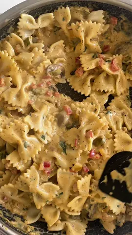 Cajun Chicken Pasta  Serves 2  For the chicken: 2 chicken breast flattened or escalope  Salt & pepper  1 cup Panko bread crumbs  1/2 cup flour  2 eggs beaten  Oil for frying  For the sauce: 140g pasta bows  Knob of butter  1 cup chestnut mushrooms cleaned and sliced  1/2 yellow bell pepper diced  1/2 red bell pepper diced  1/2 green bell pepper diced  1/2 brown onion diced  3 garlic gloves chopped  1 cup pasta water  1 cup cooking cream 1 tbsp flour  2 tbsp Cajun spice  Handful chopped parsley  1/2 cup fresh Parmesan cheese  1/2 tsp black pepper  1/2 tsp salt (taste sauce before adding at the end as the cheese can be salty enough.)  Method: 1. bring a pot of water to the boil and add some salt and the pasta until cooked. 2. As the pasta is cooking, heat a sauce pan, add the butter and a little olive oil to sauté the mushrooms.  3. Add in all of the peppers, onion and garlic. Cover with lid and cook over low heat until soft.  4. Add the Cajun spice,  flour and black pepper. Stir through. 5. Pour in the pasta water, cream, cheese and parsley. Cover with lid and Simmer over low heat.  6. Season the chicken with salt and pepper then coat with the flour shaking off any excess. Transfer to the egg then the bread crumbs. Press the bread crumbs into the chicken to ensure they are well coated.  7. Heat the oil and fry the chicken until golden. Cut into strips. 8. Drain pasta and add Into the sauce and mix well. 9. Serve and top with the chicken. 10. Enjoy 😊  #fyp #cajunpasta #cajunchicken #tiktokuk #foryou 