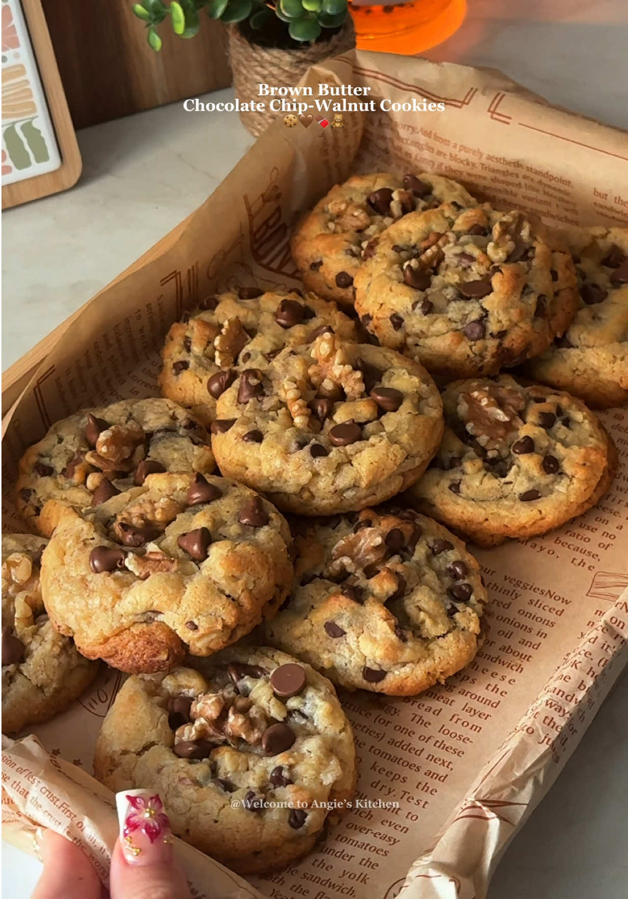 Brown Butter Chocolate & Walnut Cookies - Ingredients: - 180g unsalted butter (You’ll have about 150g after browning, which is what we are looking for) - 3/4 cup + 1 tablespoon (You’ll end up with 2/3 after browning, which is what we need!) - 100g granulated sugar - 1/2 cup - 80g light brown sugar - 1/3 cup + 1 tablespoon  - 1 large egg + 1 large egg yolk - 1 teaspoon vanilla extract - 220g all-purpose flour - 1 3/4 cup - 4g baking powder - 1 teaspoon  - 80g milk chocolate chips - 1/2 cup - 80g semi-sweet chocolate chips - 1/2 cup - 50g walnuts, chopped up -1/2 xup Notes: -  If you want to skip the brown butter, you can use regular, unsalted butter. You will need 150g, melted and cooled. - The batter is wet, so I recommend using an ice cream scoop to portion the cookies. I used a large scoop.  Instructions: 1. First we are going brown the butter.  2. Cut up the butter into cubes and place in a saucepan. Over medium heat let the butter melt. Once melted, let the butter simmer, stirring frequently until it turns golden brown. This took me a total of 10 minutes over medium heat. Once ready, pour in a different bowl and let it cool. I let mine cool for 15 minutes. 3. Once the butter has cooled down, it’s time to prepare the cookies. 4. In a large bowl mix together the butter, brown sugar and sugar. 5. Next mix in the egg, egg yolk and vanilla. 6. Add the flour along with the baking powder and mix until just combined. 7. Lastly, fold in the milk chocolate chips, semi sweet chocolate chips and chopped walnuts. 8. Using an Ice cream scoop, scoop out 11 equal cookies onto a tray, cover and refrigerate for a minimum of 1 hour. You can keep it refrigerated for up to 48 hours. 9. 10 minutes before you’re ready to bake them, preheat your oven to 170•C (using fan setting) 10. Place the cookies on a baking tray lined with parchment paper, leaving some space between them. 11. Bake in the preheated oven for 12 minutes. 12. Enjoy (: #chocolatechipcookie #cookiesoftiktok #asmr #asmrsounds #EasyRecipe 
