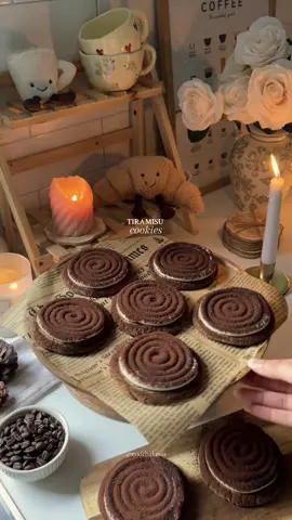 Pt.6 | My fall bakery menu 🍂 Recipe below 👇🏼  If you're obsessed with tiramisu like I am, these cookies are about to be your new favorite thing! 💘 🤎 Ingredients For the Cookies: * 110 g unsalted butter, melted  * 95 g granulated sugar * 105 g dark brown sugar * 1 large egg * 1 tsp vanilla extract * 1 tbsp instant espresso powder * 225 g all purpose flour * ½ tsp baking powder * ½ tsp baking soda * ½ tsp salt For the Mascarpone Cream: * 180 g mascarpone  * 115 g heavy cream  * 1 tsp vanilla extract * 90 g icing sugar (sifted) To Finish: * 1 tbsp unsweetened cocoa powder (for dusting) 🤎 Instructions 1. Preheat oven to 180°C. Line baking trays with parchment paper. 2. Whisk the melted butter, granulated sugar, and brown sugar.  3. Mix in the egg, vanilla extract until fully combined. 4. Whisk flour, espresso powder, baking powder, baking soda, and salt in a separate bowl. 5. Stir dry ingredients into the wet mixture just until combined. 6. Scoop 65 g of dough per cookie, roll into balls, and place on the tray spaced apart. 7. Bake for 10 minutes, cool completely. 8. Whip the mascarpone, heavy cream vanilla, and sugar until smooth.  9. Pipe a swirl of mascarpone cream onto each completely cooled cookie. 10. Dust with cocoa powder and serve. Enjoy! 🤎 #baking #tiramisu #cookies #Recipe #fall 