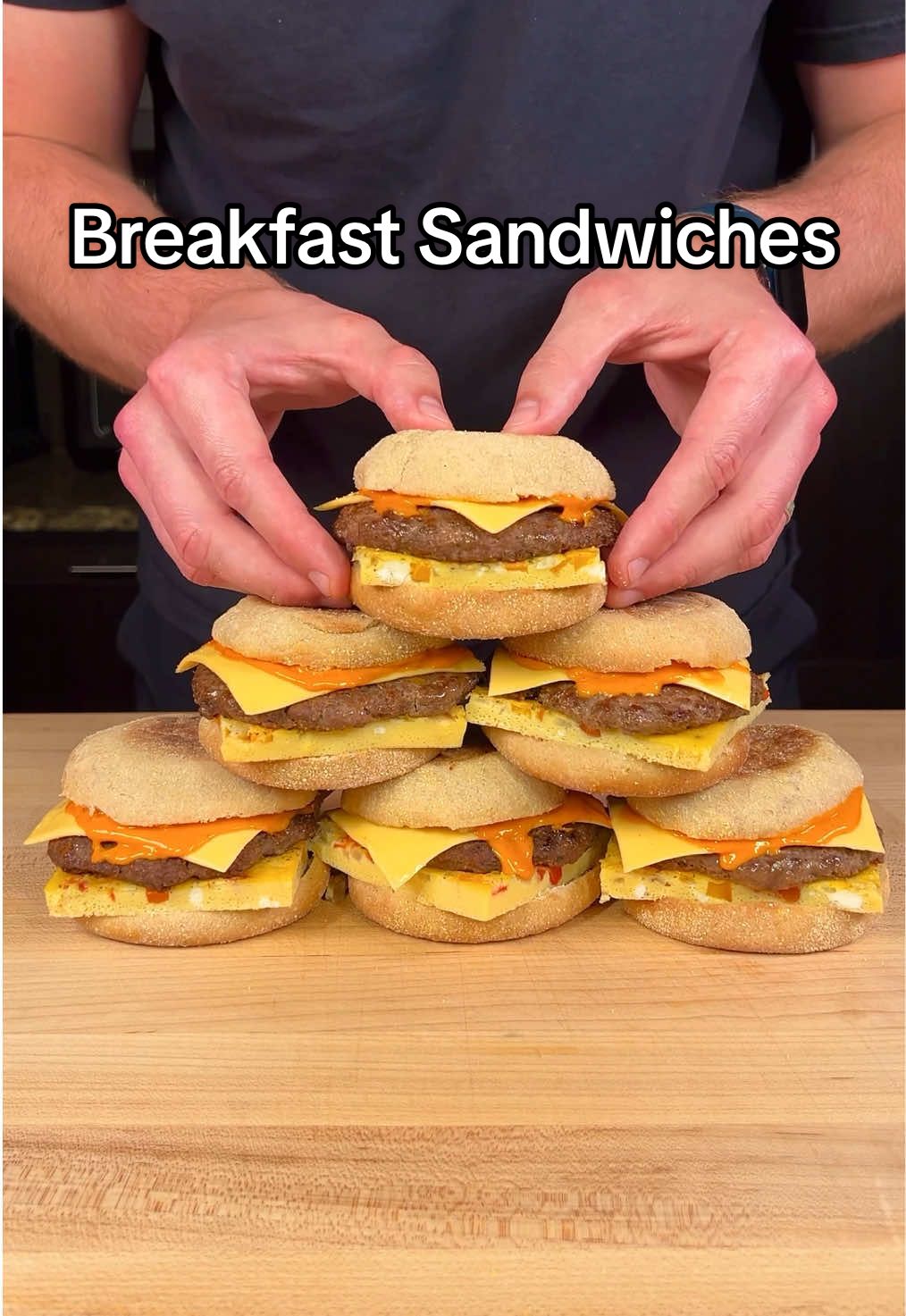 Breakfast Sandwich Meal Prep  (Makes 10 Sandwiches)  Macros Per Crunchwrap:  - 400 Calories - 45g Protein  - 30g Carbs  - 13g Fat  Ingredients:  - 30oz Lean Ground Beef (96/4) (850g) - 10oz Ground Turkey (285g) - 1 Tbsp Garlic Salt (15g) - 0.5 Tbsp Onion Powder (3g) - 1 Tbsp Italian Seasoning (7g) - 0.5 Tbsp Black Pepper (3g) - 15 Whole Eggs (900g) - 1 Cup Diced White Onions (150g) - 0.5 Cup Diced Bell Peppers (75g) - 10 Fat Free American Cheese Slices  - 10 Low Calorie English Muffins  Low Cal Sriracha Mayo 🌶️:  - 0.5 Cup Light Mayo (120g) - 0.25 Cup Sriracha (60g) - 0.25 Cup Lemon Juice (60g) - 0.5 Tbsp Garlic Salt (7g) Instructions📕:  1. Combine 30oz (850g) ground beef and 10oz (285g) ground turkey in a large bowl. Season the meat with garlic salt, onion powder, Italian seasoning, and black pepper. 2. Divide the seasoned meat into 10 equal 4oz balls and then shape the balls into thin patties. 3. Cook the patties in a pan on Medium heat until golden brown and proper internal temperature.  4. In a large bowl, combine 15 whole eggs, garlic salt, black pepper, and whist it all together.  5. Add the eggs to a greased baking tray and add in some diced onion and bell peppers (optional).  6. Bake at 350F for around 15-17 minutes or until the eggs are firm. Cut into squares.  7. (Optional) Make some sriracha mayo by combining light mayo, sriracha, lemon juice, and garlic salt.  8. Assemble the sandwiches with a low calorie English muffin, sriracha mayo (optional), one egg square, a sausage patty, and a slice of American cheese. 9. Wrap the sandwiches in parchment paper and freeze for up to a month.  Reheating Notes🔥: To reheat the breakfast sandwiches from frozen, follow these steps: Put a frozen sandwich on a plate and cover with a wet paper towel. Microwave for 4-5 minutes and enjoy! 