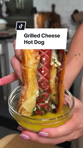 Who needs ketchup when your hot dog is THIS good? 🍅 This Grilled Cheese Hot Dog is an absolute must-make! Grilled cheese, garlic butter, and hot dogs......need we say more?! 🤤 For more on the recipe, head to the link in the @allrecipes bio. ➡️ Ingredients: 8 hot dogs 1/2 cup garlic butter, divided 8 hot dog buns 2 cups shredded cheese Directions: Preheat the oven to 400 degrees F (200 degrees C). Score hot dogs, brush with garlic butter, and place on a baking sheet. Bake hot dogs in the preheated oven until nicely browned, 6 to 8 minutes. Meanwhile, brush insides of hot dog buns with garlic butter; toast buns in a large skillet over medium heat until golden brown. Set aside. In the same skillet, lay down 1/4 cup cheese and place a bun face down on top of cheese. Cook undisturbed until cheese is melted. Remove from skillet and repeat with remaining buns. Place hot dogs in prepared buns and serve immediately. 🧑‍🍳: @guacmylife  #cheese #garlicbutter #grilledcheese #hotdogs #grilledcheese | @allrecipes 