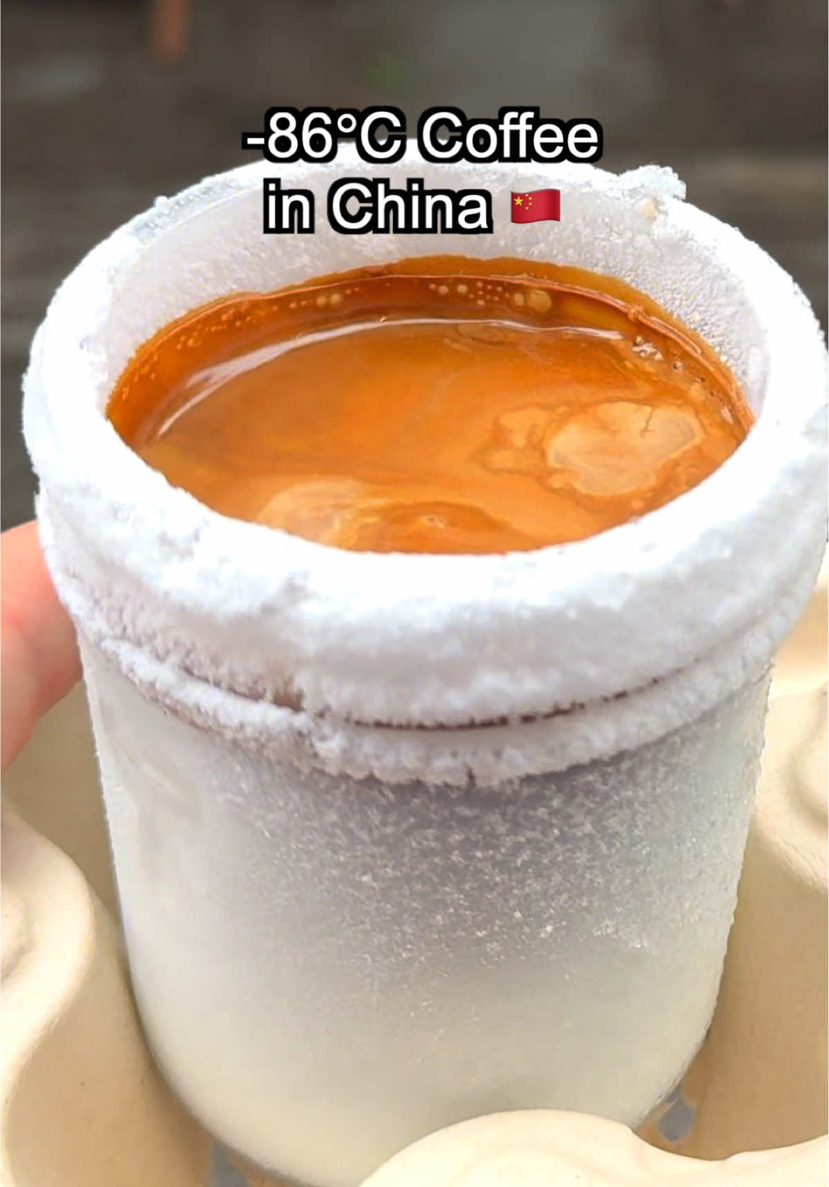 Ever tried coffee served in a negative 80 degree glass? In Chengdu, Sichuan, China, this 20 yuan ($3 USD) ice free latte keeps the espresso bold since there is no melting ice. The glass is chilled to extreme cold so the hot espresso and cold milk create a contrast that feels like ice cream with warm apple pie. This style was inspired by dirty coffee, which first became popular in Tokyo, Japan. Dirty coffee is made by pouring hot espresso over cold milk, creating beautiful layers and a mix of hot and cold flavors in one sip.  #China #Food #ChinaFood #ChineseFood #coffe 
