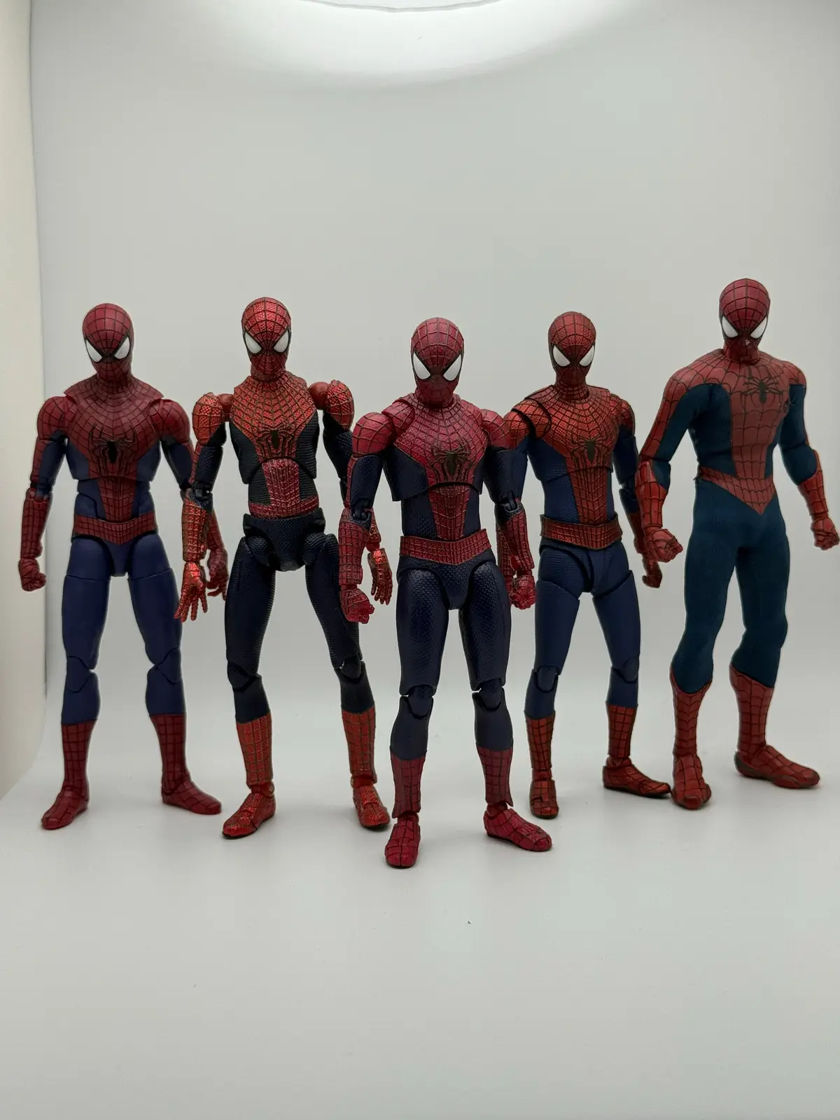 Lining up the new Mafex Amazing Spider-Man next to its predecessors really shows just how far import figure engineering has come. Starting with the Mafex No. 004 from TASM2, it’s almost like looking at two completely different eras of collecting. The old Mafex was impressive when it dropped and it was one of the first figures to even attempt this level of articulation, but now it feels dated. The proportions are clunky, with a short torso and thick limbs that just don’t capture Andrew Garfield’s lanky build. The painted-on web lines and flatter colors don’t hold up well either, and posing it next to the new release makes the difference obvious. The new Mafex has razor-sharp sculpt work with raised webbing, a deep metallic red, and vibrant whites on the lenses that bring the TASM2 suit to life. Articulation is night and day too. The old figure’s hips and shoulders always felt a little stiff, while the new one moves like butter. It’s dynamic, natural, and screen-accurate in a way the 004 never quite achieved, which makes that older figure feel more like a fun relic than a serious display piece now. The Marvel Legends TASM2 Spider-Man shows just how big the gulf is between mass-market and import figures. Don’t get me wrong, that Legends figure is still a solid toy and a nostalgic one for a lot of collectors, but standing it next to the Mafex makes it look like a completely different tier. It’s bulkier, more “comic booky,” and the painted webbing and simple matte colors feel a bit toyetic. Articulation is fine for a $20 figure, but the range and natural posing just aren’t in the same league as the Mafex. The Legends Spidey is fun to mess around with and still holds up as a budget option, but if you’re into photography or high-end display, the Mafex blows it out of the water. Now, the SH Figuarts TASM2 Spider-Man is a much closer competitor, but even then, Mafex still edges it out. The trade-off is that it’s a bit stylized and undersized, with articulation cuts that break up the sculpt. Don’t get me started on the hips. The torso feels narrow, and it doesn’t capture Garfield’s proportions quite as well as Mafex’s longer, more natural frame. The paintwork is also clean but flatter, and the webbing doesn’t have the same sculpted depth. SHF is the kind of figure that’s super fun to handle and pose, but Mafex has the realism and presence that really pops on a shelf or in photos. Putting all five together, there’s no question that the new Mafex Amazing Spider-Man is the definitive TASM2 figure. The Mafex 004 is a nostalgic throwback, Legends is a solid but simple toy, SHF is a strong posing champ but slightly stylized, and Mezco is a beautiful display piece that sacrifices articulation for aesthetics. The new Mafex combines the best of all of them. It has better range than SHF, Mezco’s premium presence, and the nostalgic appeal of Legends and the original Mafex, but with 2025-level engineering. For collectors, this is the version that finally nails Garfield’s Spidey suit in every way: proportions, color, articulation, and accessories. It’s a figure that feels just as good in-hand as it looks in photos, which is rare. #spiderman #mafex #review #toy #marvel 