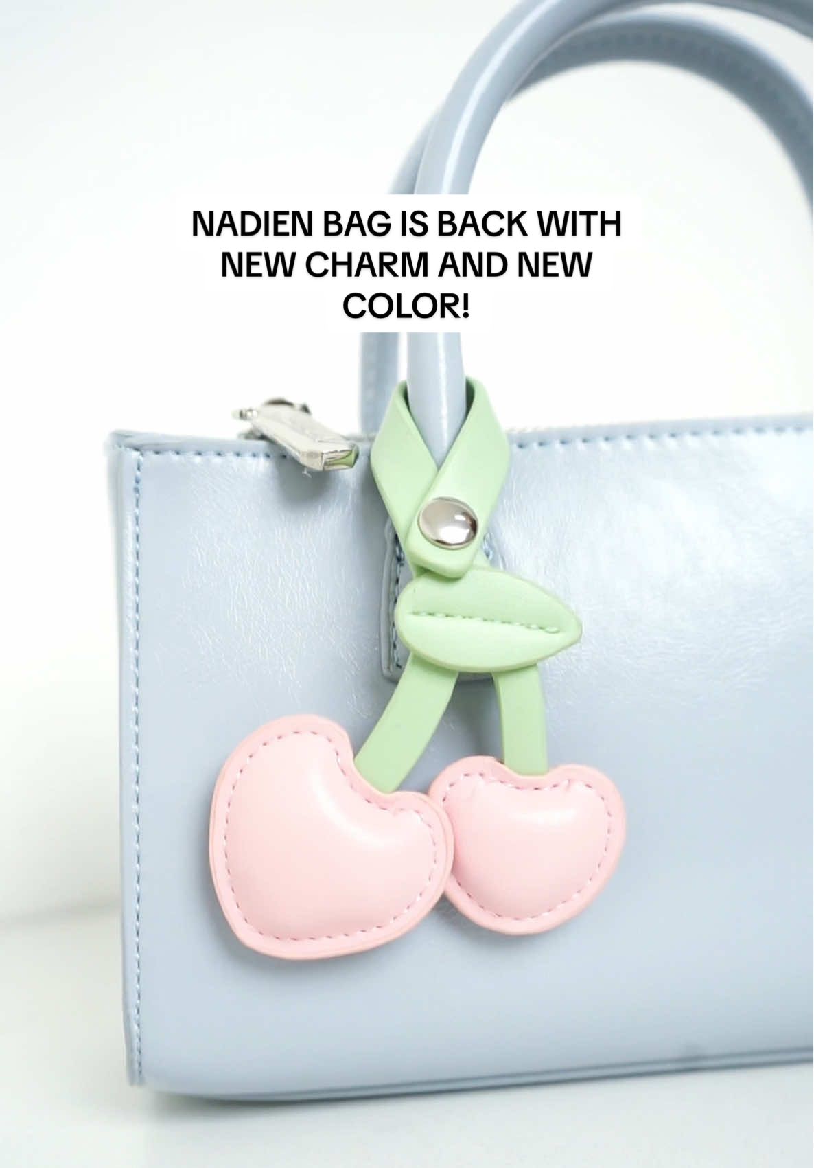New bag, new charm and new color!! Nadien bag is back in stock with her new bag charm make he look sweet like cherry ✨🍒🩵 #jimshoneyofficial #tasselempangwanita #bag 