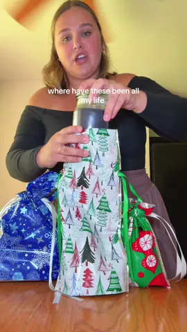 These bags for Christmas are a wrapping game changer! #wrappinggifts #christmashacks #wrappingpresents #giftbag 