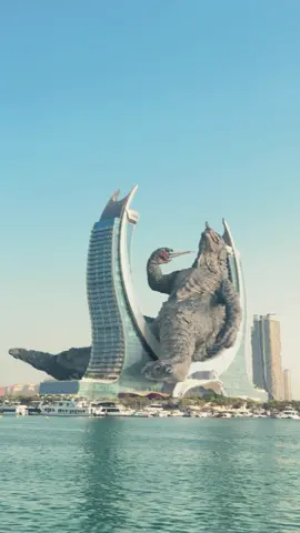 Even Godzilla can’t handle Qatar’s summer… man brought his own fan ⛵️. #GodzillaInQatar #LusailCity #CrescentTower #QatarHeat #VFXMagic
