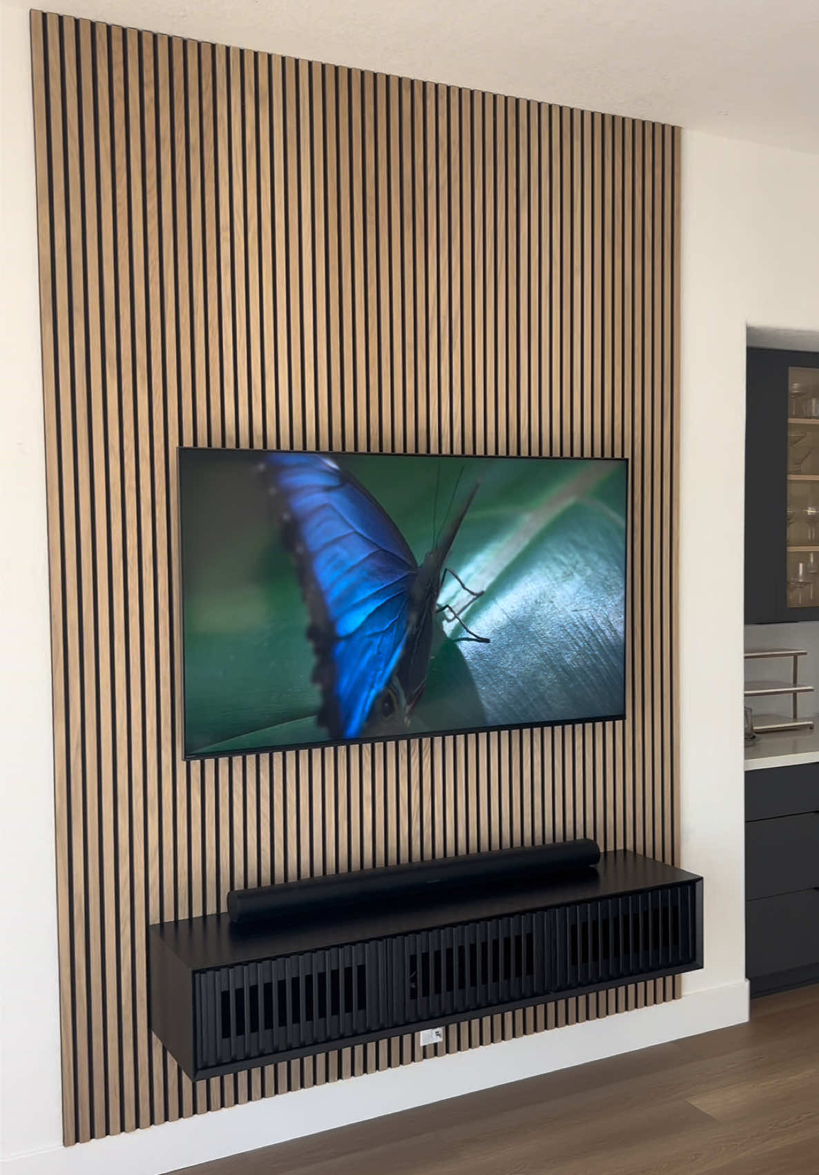 Clean and simple!  It doesn’t always have to be over the top.  Love how this customer chose a console with matching vertical slats.  Looks awesome with the wood acoustic slat panels. 🙌 . If you’re in AZ and want to do a little something to your wall(s), send us a DM for a free quote! . #inspo #designideas #accentwall #walldecor #interiordesign 