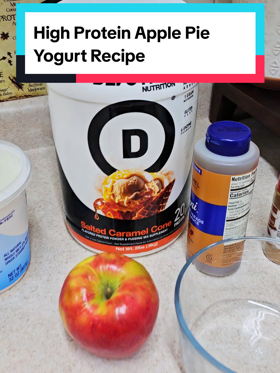 if you're in the mood for fall treats and desserts try this whole high protein fluffy yogurt recipe it is an apple pie protein yogurt it tastes just like an apple caramel pie filling just follow these directions and you will be in heaven. Chop up one Honeycrisp apple and cook it in the microwave for 2 minutes along with some apple pie spices or cinnamon, add some caramel sauce. Add two tablespoons peanut butter powder along with one scoop of The Salted Caramel cone protein powder, a cup of Greek yogurt mixed together and eat warm. It is insanely delicious. #applepie #proteinpowder #proteinyogurt #proteinrecipe #highprotein 