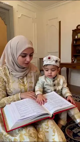 This baby is already in love with the Quran 🥹📖❤️ #IslamicVibes #quranlovers #BabyMuslim.  [1299642]