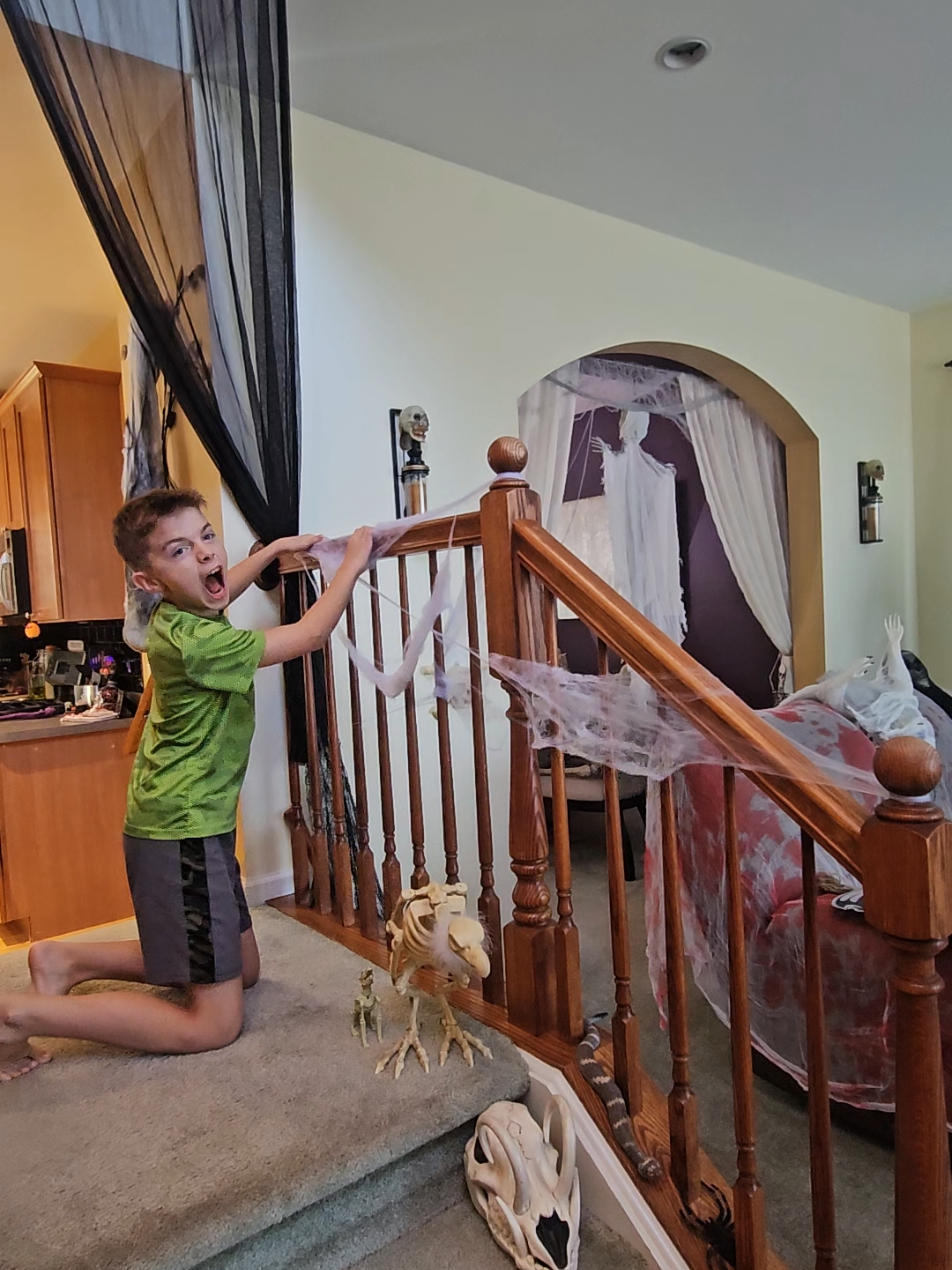 Raising him right: cobwebs go everywhere!🕷🖤🤘#halloweendecor #decorating #spookyseason #fyp #viral 