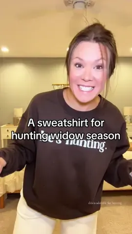One of us is sitting in the woods at 5am… the other is in this sweatshirt with coffee by the fire☕️😂 #hesHunting #huntingseason #marriagehumor #huntingwidow #cozyvibes