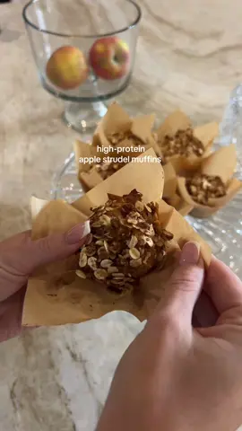 High-protein apple strudel muffins - makes 12 Ingredients: Dry 1 ½ cups Bob’s Red Mill 1-to-1 Gluten-Free Baking Flour 1 ½ tsp baking powder ½ tsp baking soda 1 ½ tsp cinnamon ¼ tsp nutmeg Pinch of salt Wet 1 ½ cups low-fat cottage cheese (blended smooth) 2 large eggs ¼ cup maple syrup or honey 3 tbsp avocado oil / olive oil / melted butter 1 tsp vanilla extract Apple Filling 2 medium apples, diced 1 tsp cinnamon 2 tbsp water Optional Streusel ½ cup rolled oats 2 tbsp brown sugar or coconut sugar 2 tbsp melted butter or coconut oil 2 tbsp Bob’s 1-to-1 flour Pinch cinnamon Instructions Simmer the diced apples with water, cinnamon, and maple syrup for 8–10 minutes until soft, then set aside to cool slightly. In a large bowl, whisk together the flour, baking powder, baking soda, cinnamon, nutmeg, and salt. In another bowl, blend the cottage cheese, eggs, maple syrup, oil until smooth and creamy, the mixture should resemble a thick, cookie dough. Pour the wet ingredients into the dry and stir until just combined (don’t overmix), then fold in half of the stewed apples. Scoop the batter into lined muffin cups, top each with the streusel topping if using. Bake at 350°F (175°C) for about 23 minutes, until the tops are golden and a toothpick inserted into the center comes out mostly clean.