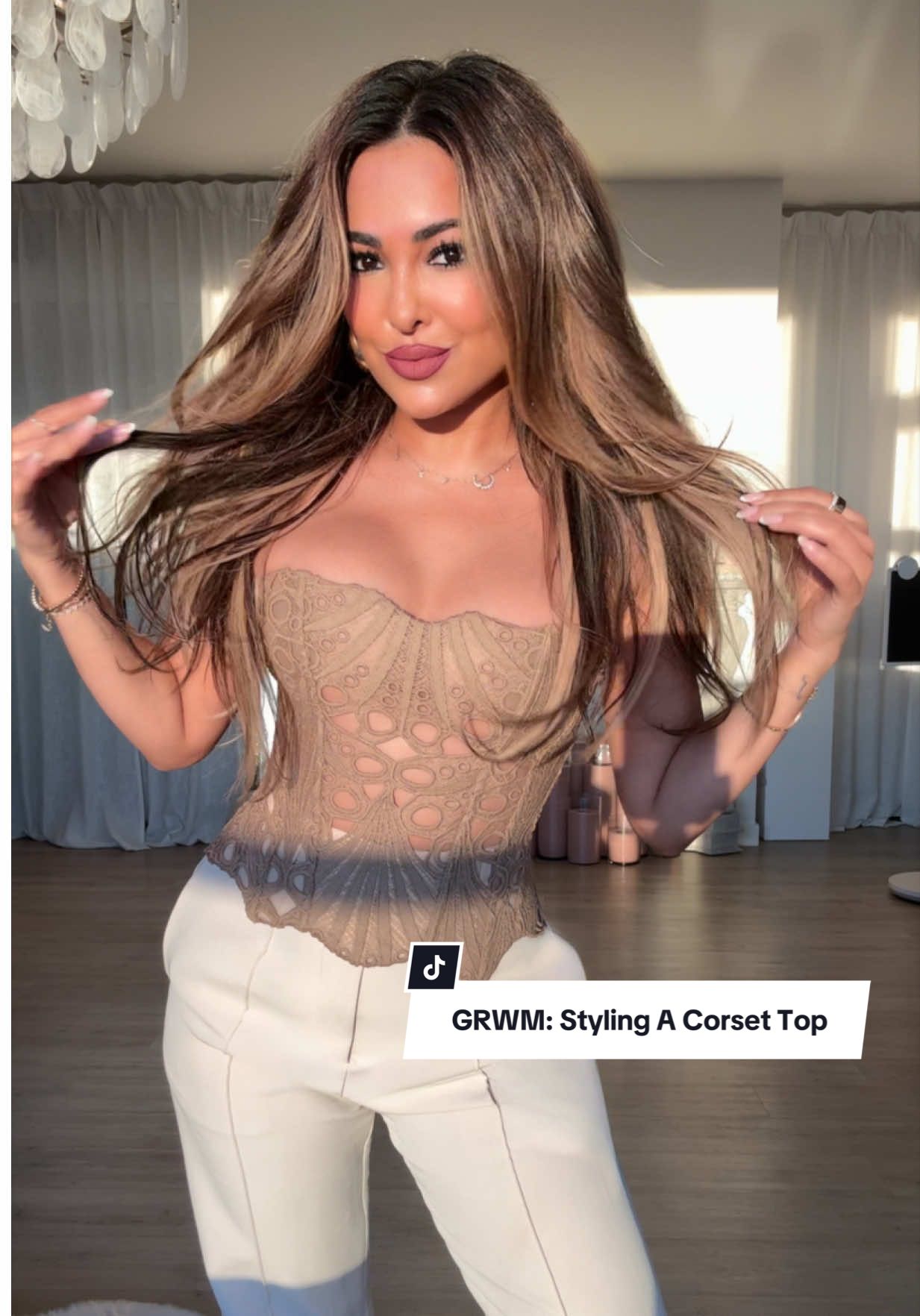GRWM: Styling A Corset Top 💫 Rate this #OOTD from 1-10 ✨ Today’s Affirmation: “I try to be present in every moment” 🤍 TAG someone who would love this & don’t forget to save the video to refer back to when styling • #outfitinspo #fashion #styletips #fyp      Outfit Details: pants — showpo  top — prettylittlething  earrings — amazonfashion  perfume — guccibeauty  bag — valentino.beauty  lips — smashboxcosmetics lip pencil anastasiabeverlyhills liquid lipstick  glow oil — patricktabeauty  texturizing spray — oribe 