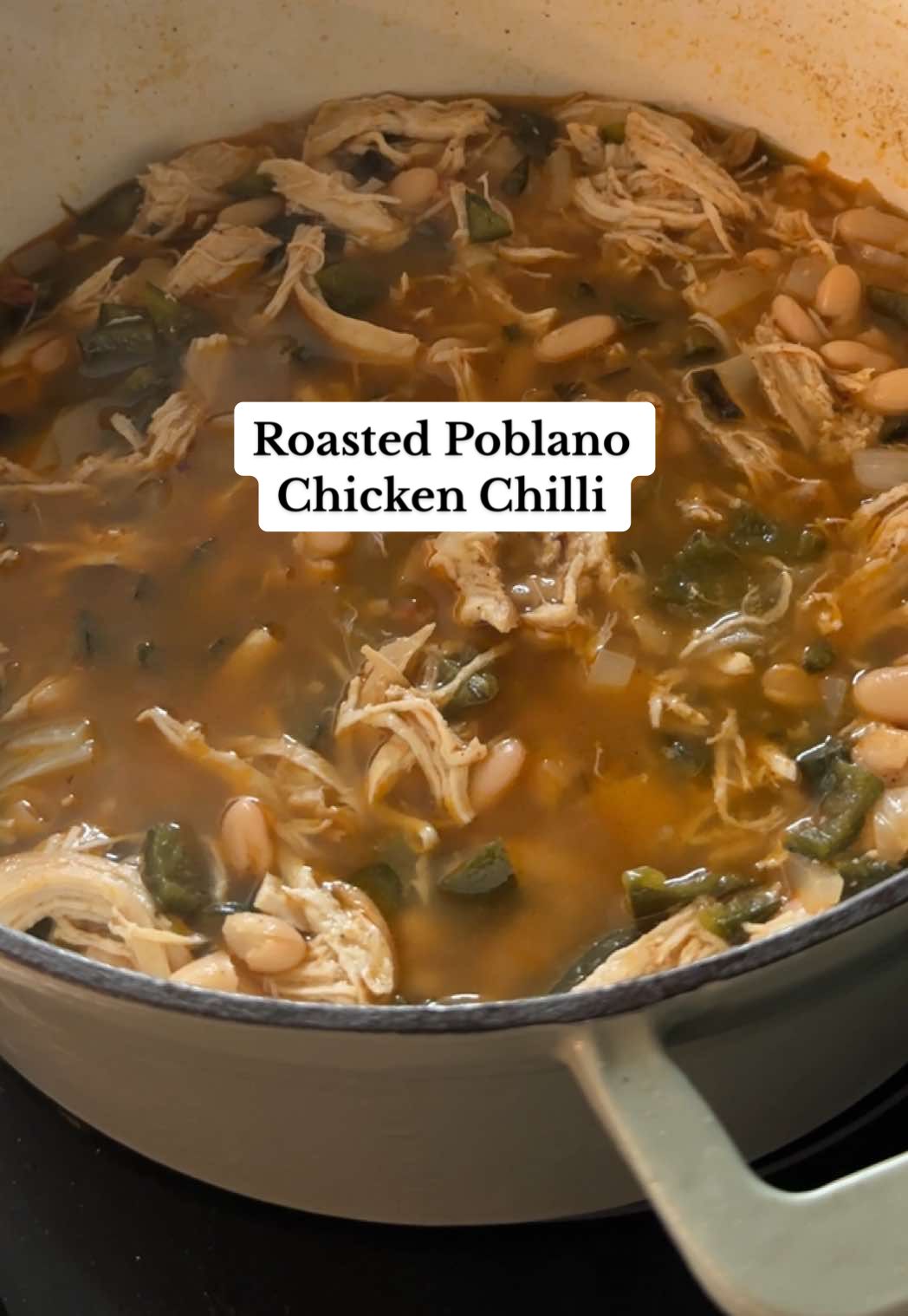 Who’s excited for soup season?? Chicken Chili is a staple soup recipe for me in the fall and adding the roasted poblanos takes it to the next level, you have to give this one a try!  The full recipe is down below ⬇️  Ingredients: 3 large poblano peppers 2-3 chicken breads  4-5 cups chicken broth  2 cans great northern or cannellini beans drained  1/4 block of cream cheese (about 2 ounces) 2 cups frozen sweet corn or 1 can drained  1/2 white onion  2 tablespoons avocado oil/olive oil  Seasoning: 1 teaspoon each of salt, ground black pepper, chili powder, smoked paprika, garlic powder, onion powder, ancho chili powder. 1/2 tsp cumin, 1/4 tsp cayenne.  Instructions: 1. Preheat your oven to 400 F. Place 3 large poblano peppers on a foil lined baking sheet. Bake covered for 25 minutes and uncovered for 20 minutes. 2. While the peppers are cooking. Sprinkle half of the seasoning mixture on the chicken. Heat a deep pot over medium heat and add the seasoned chicken. Cook for 4-5 minutes each side until golden brown.  3. Add the chicken broth to the pot with the chicken and reduce the heat to medium low. Cook for about 20 minutes until the chicken is cooked all the way through.  4. Remove the cooked chicken from the pot and set it aside to cool. Shred once cooled. 5. Slice and dice the cooked poblano peppers and onion then add them to the pot, along with the drained beans and shredded chicken.  6. Add about 2 ounces of cream cheese to the pot, cover with a lid to let it melt. Let it simmer about 20 minutes.                 I recommend to Serve with rice or cornbread and top with sour cream, shredded cheese, and hot sauce. Enjoy, and Let me know what you think! #souprecipes #fallrecipes #chickenchili #chickensoup #cooking  