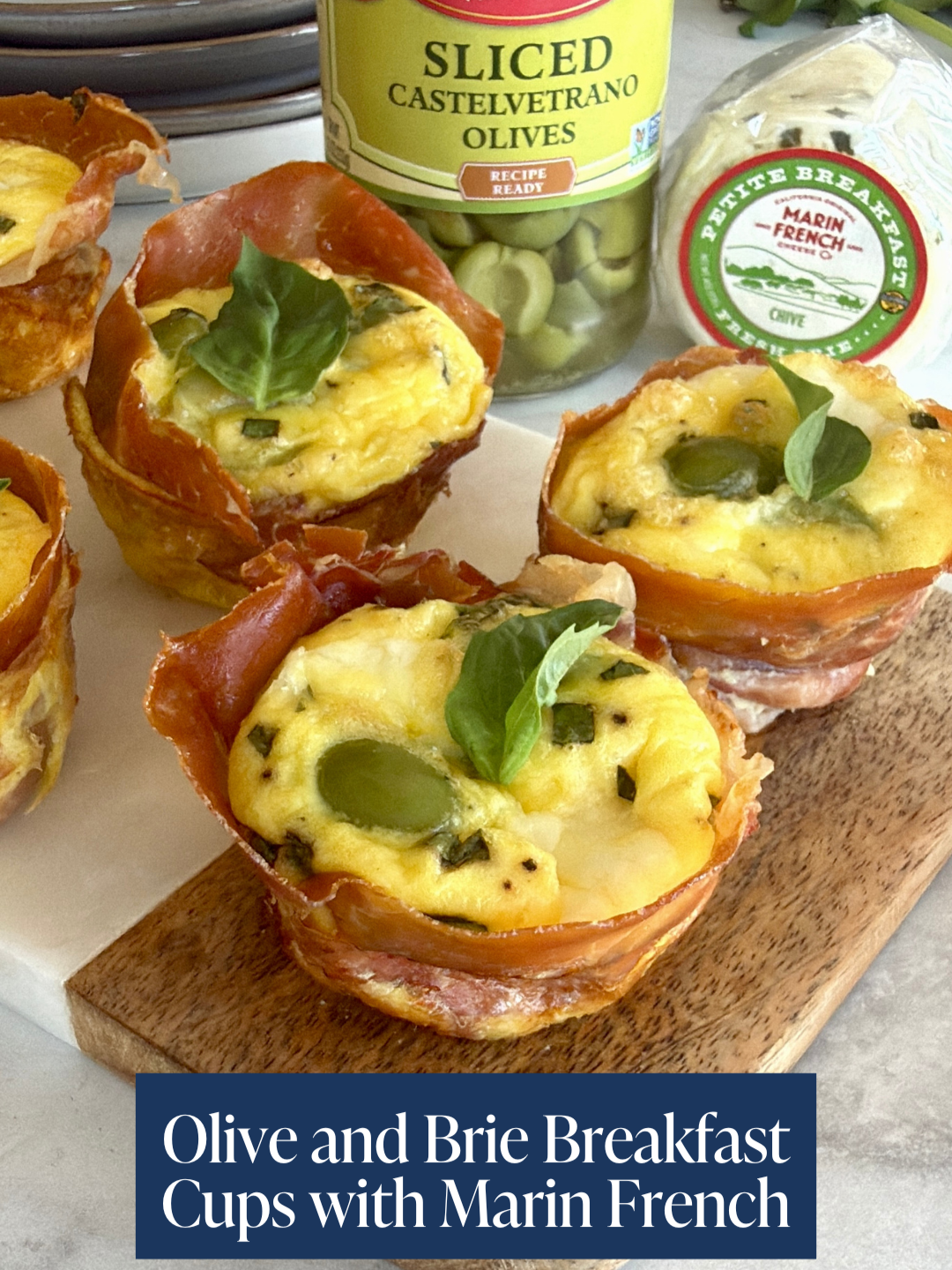 Hosting brunch? These Olive Frittata Cups with Fresh Breakfast Brie are the definition of impressive made easy.  Petite Breakfast Chive is a tangy and herbaceous fresh brie from @marinfrenchcheese Creamy cheese + buttery Mezzetta Castelvetrano Olives = a pairing your guests will love! 😍