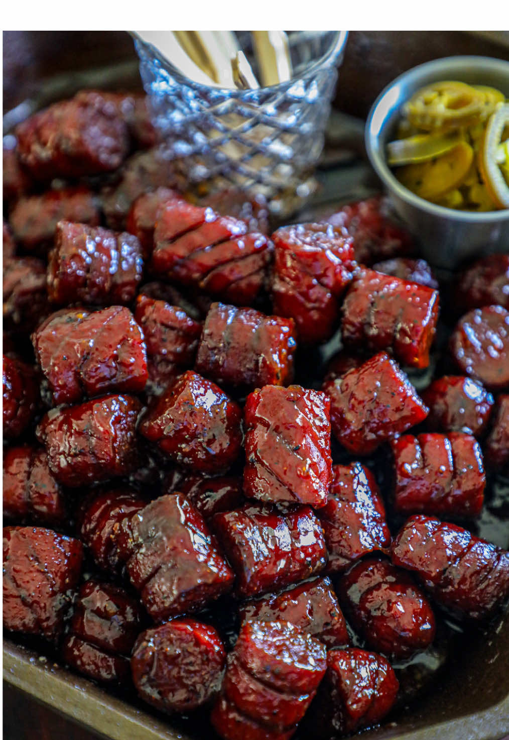 Smoked Bison Sausage BBQ Bites 😅🔥 Recipe by👇 @Bonappeteach  These smoked bison sausage BBQ bites are a bold, smoky twist on classic burnt ends that are made by slow-smoking bison sausage until caramelized, then tossing in a sticky-sweet BBQ glaze. Bite-sized, flavor-packed, and perfect for game day or backyard BBQs, they deliver deep smoke flavor with a rich, lean bite. TOTAL SERVINGS:10-12 PREP TIME: 15 COOK TIME:2 Hours  INGREDIENTS (make sure to include measurements) * 1 lb. Smoked Bison Sausages * 2 tbsp. Mustard * BBQ Dry Rub as needed * 4 tbsp. Butter * 1/3 cup Brown Sugar or honey * BBQ Sauce as needed THE COOK (45 minutes) 1. Preheat the smoker to 250 F. and set it for indirect heat. 2. Prep the smoked bison sausage by slicing into the sausage link every ½ inch or so without cutting through the link. Turn it over and repeat, but slicing on a slight diagonal. Cut the sausage into 4-5 smaller pieces to make them bite-sized.  3. Once the bison sausage is sliced, coat it entirely in a thin mustard binder, including into the sliced spaces. Then cover in a thin layer of the BBQ dry rub. 4. Place the smoked sausage onto the smoker and let it smoke for 1.5 hours. The sausage should be heated through, lightly browned, and slightly plumped up. 5. Remove the smoked sausage from the grill. Place them into an aluminum foil or cast-iron pan. Coat them in enough BBQ sauce that they are fully covered, add the butter over the top, and sprinkle on the brown sugar. 6. Place the pan back onto the smoker for 30 minutes, stirring a few times as needed so they caramelize and are evenly coated in the mixture. When they are set up and the sauce is tacky and shiny, remove from the grill and serve as desired.   WHAT SMOKER/GRILL WAS USED: Tahoma 1200 