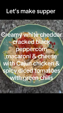 Nothing beats comfort food with a spicy kick.  This creamy white cheddar with crushed black peppercorn mac & cheese is topped with Cajun chicken and diced tomatoes with green chilies for the perfect balance of creamy, cheesy, and bold. The ultimate weeknight dinner or cozy weekend indulgence—rich, zesty, and full of flavor in every bite! Would you try this version of mac & cheese? #MacAndCheeseLover #CajunChicken #ComfortFood #CheesyGoodness #SpicyEats     