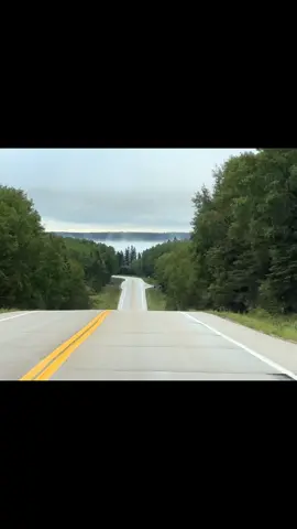 #ClearLake wrapped in morning fog, seen from my favourite stretch of highway 10 through #RidingMountainNationalPark — a reminder of how beautiful stillness can be. #ExploreMB        #FoggyMorning #moodynature 