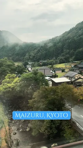 Maizuru, Kyoto Prefecture, Japan Green hills, hidden village. View from a train, rural Japanese countryside..