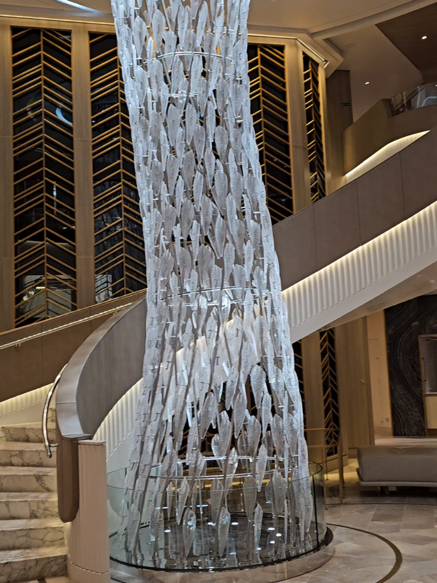✨ Oceania Vista Atrium: Where Luxury Sets the Tone ✨ Step into the atrium of Oceania Vista — a space that redefines elegance at sea. 🌊💎 Beneath the sparkling chandelier, surrounded by sculptural details and soaring design, this isn’t just a passageway — it’s a statement. Modern, serene, and effortlessly luxurious. 🛋️✨ 📍 Oceania Vista Atrium 💡 Glittering centerpiece 🌀 Curved architecture 🎶 Quiet sophistication 🍸 The kind of place you linger... just because. This is how you start a cruise — with beauty, grace, and a little jaw drop. #OceaniaVista #CruiseAtriumGoals #LuxuryAtSea #ModernCruising #CruiseDesign #FloatingLuxury  Let me know if you're pairing it with multiple angles in a carousel or want something more minimalist or moody!