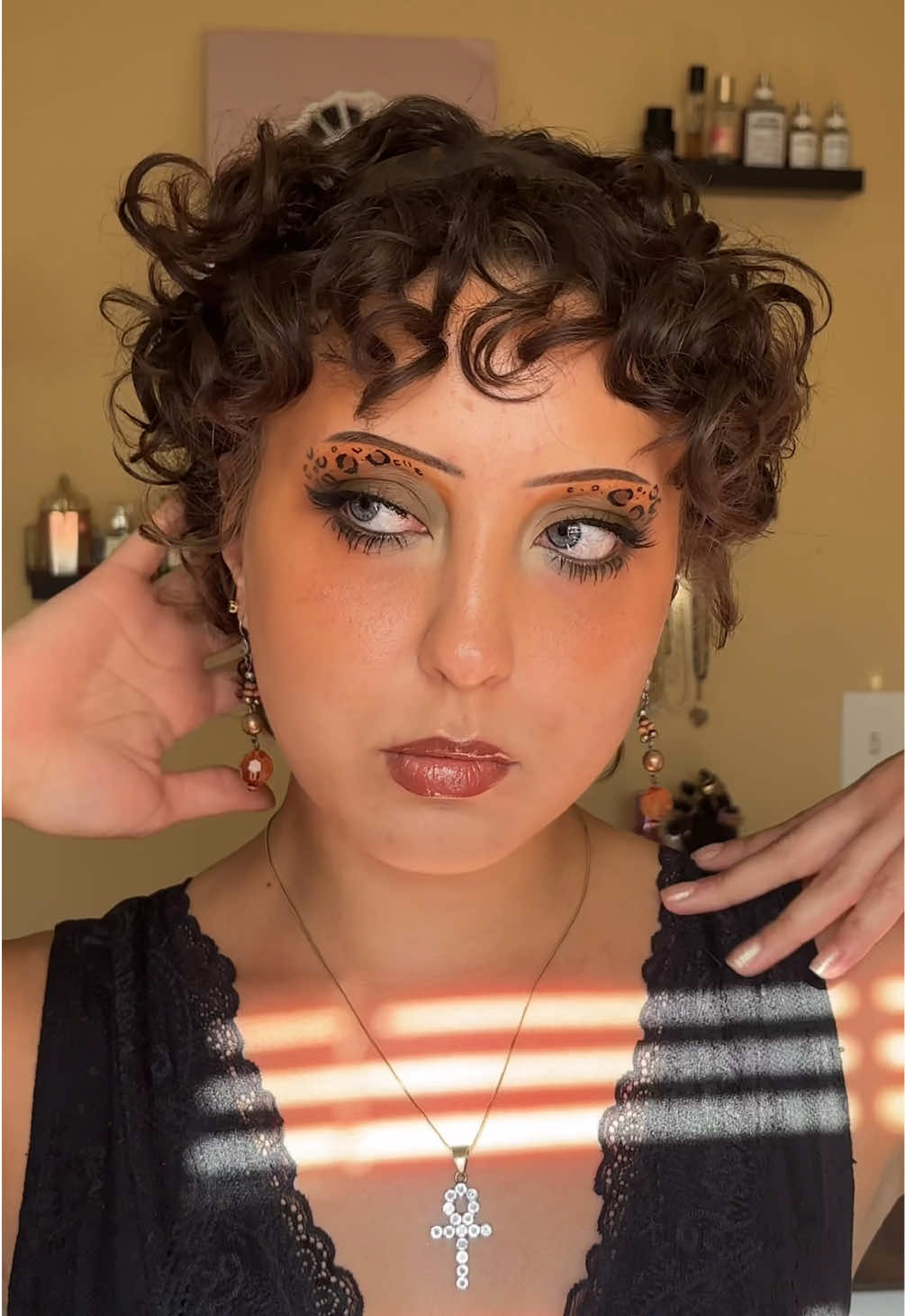 This color palette is SO good! Major Fall/Autumn vibes (I love summer but I am so ready!!)  Major products used: (* = gifted) @medusasmakeup Stick It eyeshadow primer  @Laura Geller Beauty Seasonless Staples Wild Flower Wishes eyeshadow palette* @NYX Professional Makeup Epic Ink Liner in Black  @shadesbyshan Matcha eye liner* @velourbeauty Plant Based lashes in Butterfly Effect @DEDESIGNATURE Bliss Blush Trio* Necklace and dangly earrings are thrifted Studs from @Shop with Shop LC * #leopardprinteverything #graphiceyelinerlook #creativemakeupart  #eyeshadowinspiration #creativeeyeliner 