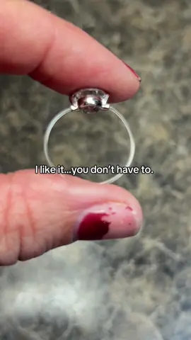 Yes it’s unique, yes it’s Moissanite, yes it looks like a dermal piercing.  It’s unique and makes it so I can wear a ring again.  You don’t have to like it.  #moissanite #floatingring #hypoallergenic 