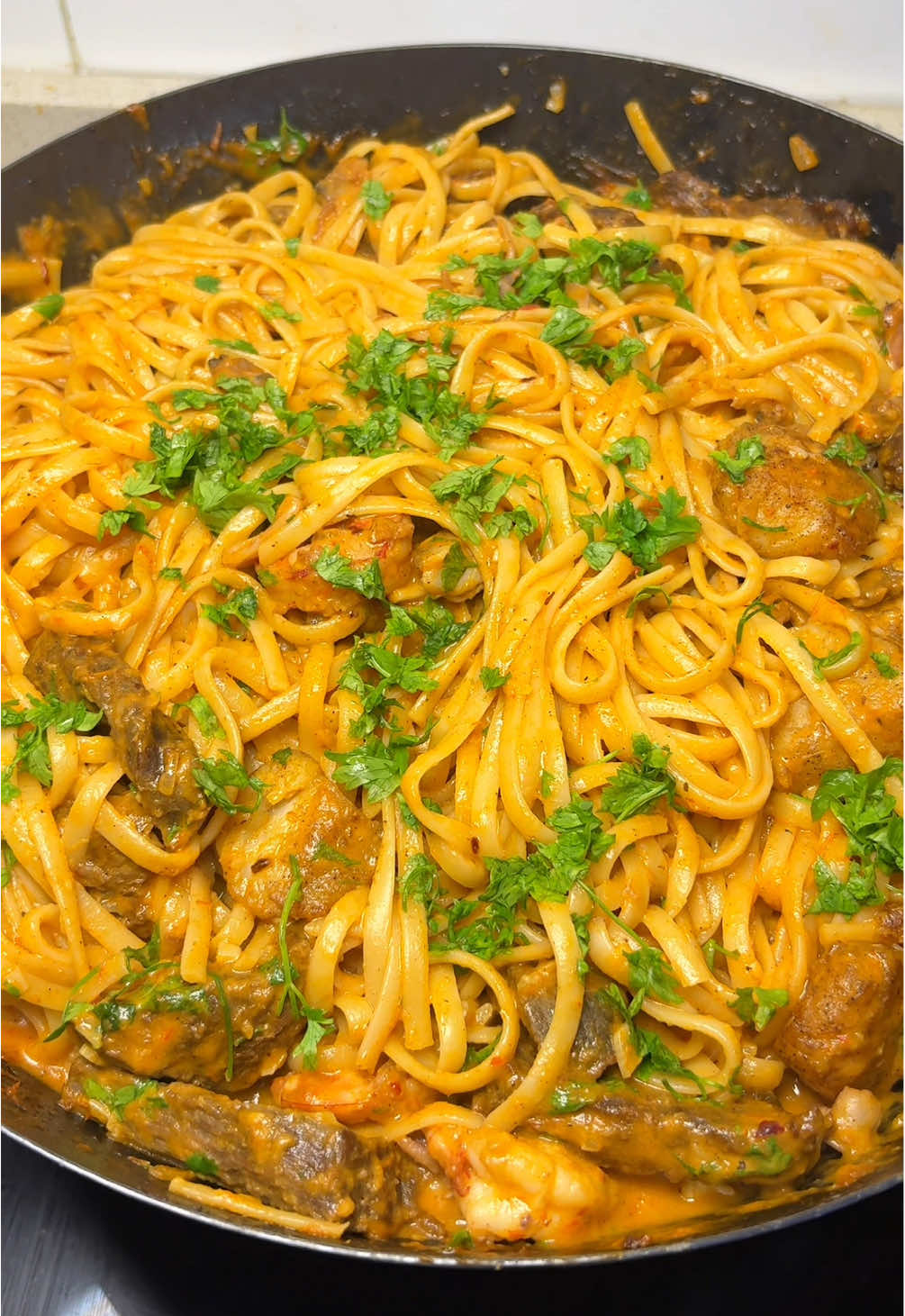 Surf and turf Linguine pasta✨ • Best of both worlds. Mouthwatering goodness💕 • Ingredients  Linguine  Beef fillet  Seafood cocktail (seafood mixture) Fish fillet Pepper mix (tomatoes, red bell pepper, habanero, spring onions, tatashe) Onions and chopped garlic Cooking cream (little bit) Chicken seasoning cubes Sesame oil Parsley Chilli flakes  • I already marinated my proteins before frying them✨ • #surfandturf #pastarecipe  Surf and turf pasta #creatorsearchinsight #foodblogger  